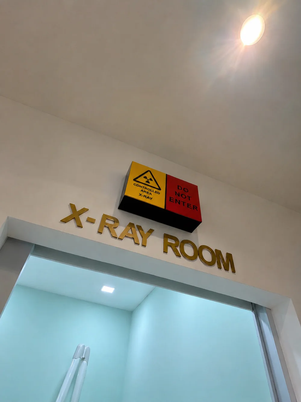 Entrance to the controlled X-ray room at Kayangan Dental Clinic